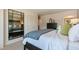 Serene main bedroom features a mirror, dresser, and a cozy bed with blue and white bedding at 140 Holton St, Smithfield, NC 27577