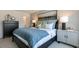 Comfortable main bedroom includes a dresser, nightstand, and a queen bed with decorative pillows at 140 Holton St, Smithfield, NC 27577