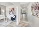 Hallway featuring modern flooring and decor, leading into the bright and open living space at 157 Klamath Dr, Garner, NC 27529