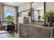 Stylish bedroom featuring modern decor, large mirror and a window with picturesque views at 160 Kobus Ct, Garner, NC 27529