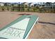 A view of the community area with a cornhole game, benches and green space for residents to enjoy at 160 Kobus Ct, Garner, NC 27529