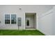 Home's rear entrance with a fenced yard and window at 164 Starlight St, Sanford, NC 27330