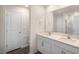 Bathroom features a double sink vanity with ample counter space and a large mirror at 164 Starlight St, Sanford, NC 27330