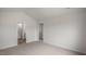 Spacious bedroom with soft carpet flooring, featuring ensuite bath and walk-in closet access at 164 Starlight St, Sanford, NC 27330