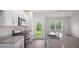 Bright kitchen features granite countertops, stainless steel appliances, and a backyard view at 164 Starlight St, Sanford, NC 27330