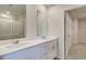 Bright bathroom featuring double sinks with vanity and glass-enclosed shower at 165 Klamath Dr, Garner, NC 27529
