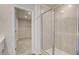 This bathroom features a glass-enclosed shower and connects to the walk-in closet at 165 Klamath Dr, Garner, NC 27529