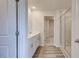 Bright bathroom featuring double sinks with vanity, hard surface floors and glass-enclosed shower at 165 Klamath Dr, Garner, NC 27529