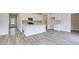 Bright kitchen features white cabinets, granite countertops, and stainless steel appliances at 165 Klamath Dr, Garner, NC 27529