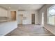 Open-concept kitchen boasts ample counter space, modern finishes, and easy access to the outdoors at 165 Klamath Dr, Garner, NC 27529