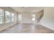 Bright and airy living room with hardwood floors, staircase, and large windows for natural light at 165 Klamath Dr, Garner, NC 27529