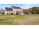 Spacious backyard with patio, pergola, and home exterior view at 170 Blande Dr, Kenly, NC 27542