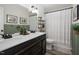 Well-lit bathroom with a double sink vanity, stylish mirror, and modern fixtures at 170 Blande Dr, Kenly, NC 27542