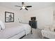 Cozy bedroom with a ceiling fan, black dresser, and neutral-toned decor and wall art at 170 Blande Dr, Kenly, NC 27542