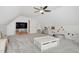 Bright bonus room with a TV, playroom, and storage at 170 Blande Dr, Kenly, NC 27542