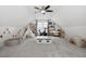Versatile bonus room with a play area and an exercise space under a ceiling fan at 170 Blande Dr, Kenly, NC 27542