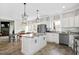Open-concept kitchen with granite counters, an island, stainless appliances and a dining area at 170 Blande Dr, Kenly, NC 27542