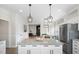 Well-appointed kitchen with granite countertops, stainless appliances and an island with seating at 170 Blande Dr, Kenly, NC 27542