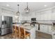 Bright and airy kitchen with large island, stainless appliances and modern pendant lighting at 170 Blande Dr, Kenly, NC 27542
