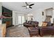 Inviting living room with a fireplace, plush leather furniture, and an open view to the kitchen at 170 Blande Dr, Kenly, NC 27542