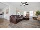 Cozy living room features natural light, an open floor plan and comfortable leather seating at 170 Blande Dr, Kenly, NC 27542