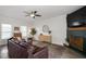 Inviting living room features a ceiling fan, decorative fireplace and lots of natural light at 170 Blande Dr, Kenly, NC 27542
