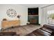 Cozy living room with a decorative fireplace, large TV, and comfortable leather seating at 170 Blande Dr, Kenly, NC 27542