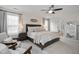 Relaxing main bedroom with sitting area, ceiling fan, and soft colors at 170 Blande Dr, Kenly, NC 27542