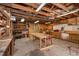 Well-organized workshop with ample lighting, shelving, a workbench, and tools at 170 Blande Dr, Kenly, NC 27542