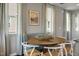 Dining area with an oval table, seating for six, and large windows providing natural light at 180 Kobus Ct, Garner, NC 27529