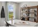 Bright art studio featuring a large window for natural light, and shelves for art supplies at 180 Kobus Ct, Garner, NC 27529