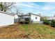 A sprawling backyard featuring a shed, a deck, and healthy green grass at 1817 Rankin St, Raleigh, NC 27604