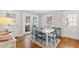 Bright dining room with access to outside and adjacent room with a view of outside landscape at 1817 Rankin St, Raleigh, NC 27604