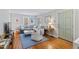 Bright living room features hardwood floors, a cozy gray sofa, and tasteful decor at 1817 Rankin St, Raleigh, NC 27604