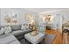 Comfortable living room with a gray sofa set, stylish decor, and ample natural light at 1817 Rankin St, Raleigh, NC 27604