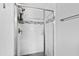 Bathroom shower with clear glass enclosure with silver hardware and marbled tiling at 1817 Rankin St, Raleigh, NC 27604