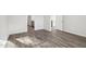 This bedroom boasts luxury vinyl plank flooring and freshly painted neutral walls at 185 White Birch Ln, Angier, NC 27501