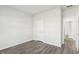 Bedroom with hard wood flooring, white walls, and white door at 185 White Birch Ln, Angier, NC 27501