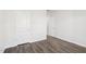 Bedroom with hard wood flooring, white walls, and white doors at 185 White Birch Ln, Angier, NC 27501