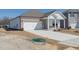 Beautiful home showcasing brick and siding exterior, attached two-car garage, and landscaping ready for personalization at 185 White Birch Ln, Angier, NC 27501