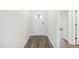 Bright and airy foyer featuring wood-look flooring, fresh neutral paint, and an attractive entry door at 185 White Birch Ln, Angier, NC 27501