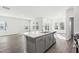 Kitchen island with gray cabinets and stainless steel dishwasher at 185 White Birch Ln, Angier, NC 27501