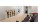 Finished basement, decorated with neutral tones, cabinet with display storage and sitting area at 193 Millennium Dr, Pittsboro, NC 27312
