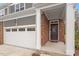Close-up of the townhome's entrance, showcasing the brickwork and an inviting front porch at 193 Millennium Dr, Pittsboro, NC 27312