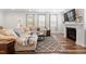 Comfortable living room with plush sectional sofa, fireplace and modern decor for relaxing Gathering time at 193 Millennium Dr, Pittsboro, NC 27312