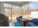 Relaxing screened-in porch with comfortable seating and views of the backyard at 193 Millennium Dr, Pittsboro, NC 27312