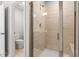 Modern walk-in shower with glass doors and tiled walls at 193 Millennium Dr, Pittsboro, NC 27312