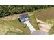 Aerial view of a two-story home with a well-manicured lawn and a long driveway leading to the property at 20 Diamond Creek Dr, Zebulon, NC 27597