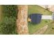 Aerial view of home showcasing roof, wooden deck, manicured lawn, and surrounding landscape at 20 Diamond Creek Dr, Zebulon, NC 27597