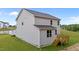 Exterior house view showcasing backyard wooden deck and grassy lawn at 20 Diamond Creek Dr, Zebulon, NC 27597